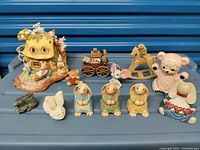 All figurines including light-up cottage and animal characters in set
