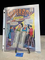 Front cover of DC Superboy Comic Book #3 in protective sleeve on display stand, showing cover art and condition.