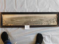 Full view of framed large panoramic photograph showing the 1932 LA Olympics Opening Ceremony taken from stands looking down at the stadium filled with athletes and spectators.
