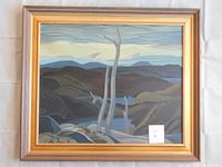 Framed serigraph full view showing landscape of hills and tree in gold-tone frame