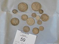 Top view to show entire coin lot including various silver coins of different denominations and designs.