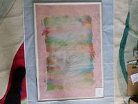 Front view of the framed abstract painting showing overall colors and texture.