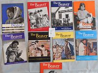 Nine issues of The Beaver Magazine arranged in three rows, showing colorful and historic covers.