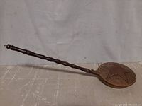 Full view of copper bed warmer showing the entire handle and pan.