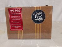 Front of sealed box set showing title, label with product details, and design.