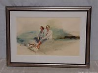 Front view of the framed William Bracken artwork showing two figures sitting near water.