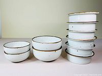 Front view of four soup bowls and six ribbed bistro bowls stacked in two columns