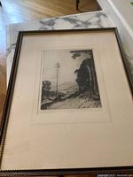 Framed original ink drawing showing full framed piece on a marble surface with part of the floor visible.