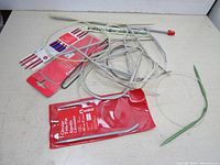 Top view of the circular knitting needles laid on a surface showing cords and needle tips with packaging visible.