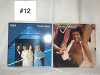 Front covers of ABBA Voulez-Vous and Tom Jones Rescue Me vinyl records side by side.