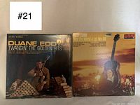 Front covers of Duane Eddy and Patsy Cline vinyl records, showing album titles and artists.