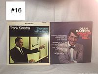 Front covers of two vintage vinyl records: Frank Sinatra 'Strangers In The Night' and Dean Martin 'Greatest Hits Vol. 1'