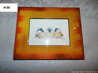 Photo of framed vintage bird print #130 with three small birds in orange-brown gradient frame