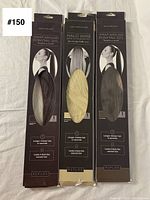 Front view of three hair extension packages side-by-side showing hair color and brand Peplos.