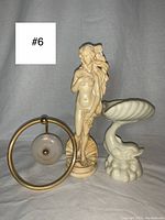 Photo showing all three items together: Venus statue, dolphin soap dish, gold and marble ring hand towel rack