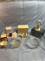 Lot overview including Lenox angel statue, Christmas ornament, Royal Doulton Bunnykins mug, two glass bowls, and apple figurine.