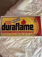 Photo of closed box front showing branding, size and firelog weight information