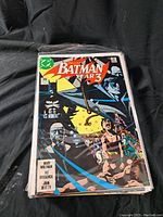 Front cover of Batman Year 3 comic, showing detailed artwork with multiple characters and title.
