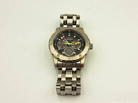 Front view of Nautica diver watch showing black dial, subdials, bezel, and metal bracelet.