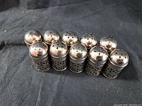 All 10 silver-tone vintage salt and pepper shakers grouped together showing uniform design and hallmarked E.P.N.5