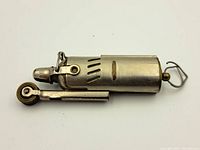 Top view of the metal lighter showing the wheel ignition and main body