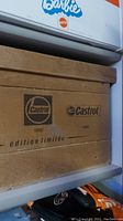 Wooden box showing Castrol logos from 1922 and 1965 with 'édition limitée' text.