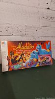 Photo of the front of the Disney Aladdin The Magic Carpet Game box showing artwork and branding.