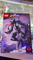 Front and back view of LEGO Marvel Spider-Man Venom set box showing the assembled Venom figure.