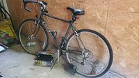 Full side view of the dark-colored Norco bicycle with drop handlebars and visible rear derailleur.