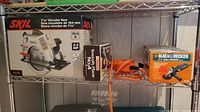 Photo showing the Skil circular saw box, Mastercraft smooth plane box, and Black & Decker angle grinder box placed on a shelf.