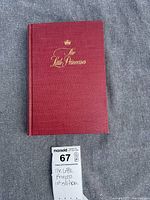 Front cover of the hardcover book 'The Little Princess' by Marion Crawford in red with gold embossed title and a crown symbol.