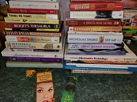 Stack of various books showing titles and conditions.