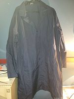 Full front view of navy blue Red Kap work coat untied.