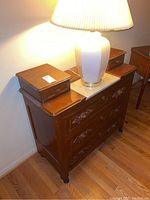 Full dresser with white marble top, two small wooden compartments, and three carved wooden drawers with brass handles.