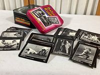 Photo of black and white Babe Ruth cards spread out with the original pink tin box visible.
