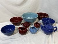 Full set including multiple mixing bowls, teapots, creamers, and sugar bowls in blue, light blue, and burgundy colors