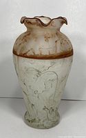 Photo showing front and side view of the Murano two-tone glass vase with wavy rim and brown color gradient over clear footed base.