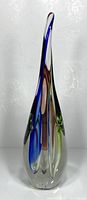 Tall vintage blown glass teardrop sculpture with internal colorful design.