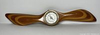 Full front view of the wooden propeller shaped barometer and thermometer with Elkro branding, showing the entire 24 inch length.