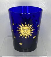 Front view showing gold sun and stars on blue glass
