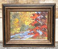 Full view of framed vintage unsigned oil painting on masonite, showing autumn leaves and a small stream in warm fall colors.