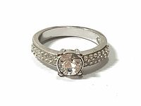Front view of Swarovski solitaire crystal ring showing solitaire and pave crystals on band.