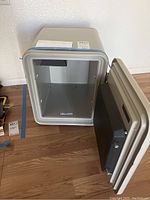 Open safe showing interior empty metal-lined compartment.