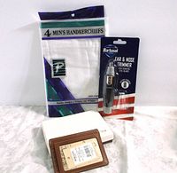 Photo showing all three items included in the lot: Boconi ID card case, white handkerchiefs pack, and Barbasol nose trimmer in packaging.