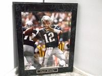 Framed 13x10 photo plaque of Tom Brady in Patriots uniform, showing the entire plaque.