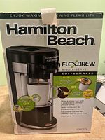 Front of the Hamilton Beach FlexBrew coffee maker box showing the product image and branding.