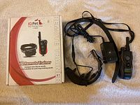 Dogtra 280C remote trainer e-collar with remote control unit and packaging of iQ Pet remote trainer.