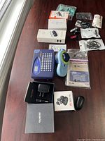 Full lot setup on a reddish wooden table with all items visible