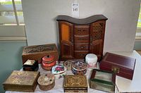 Full lot of 13 assorted jewelry boxes in various shapes and sizes, showing wood, lacquer, glass, metal, and porcelain.