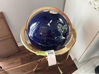 Full front view of assembled globe and stand